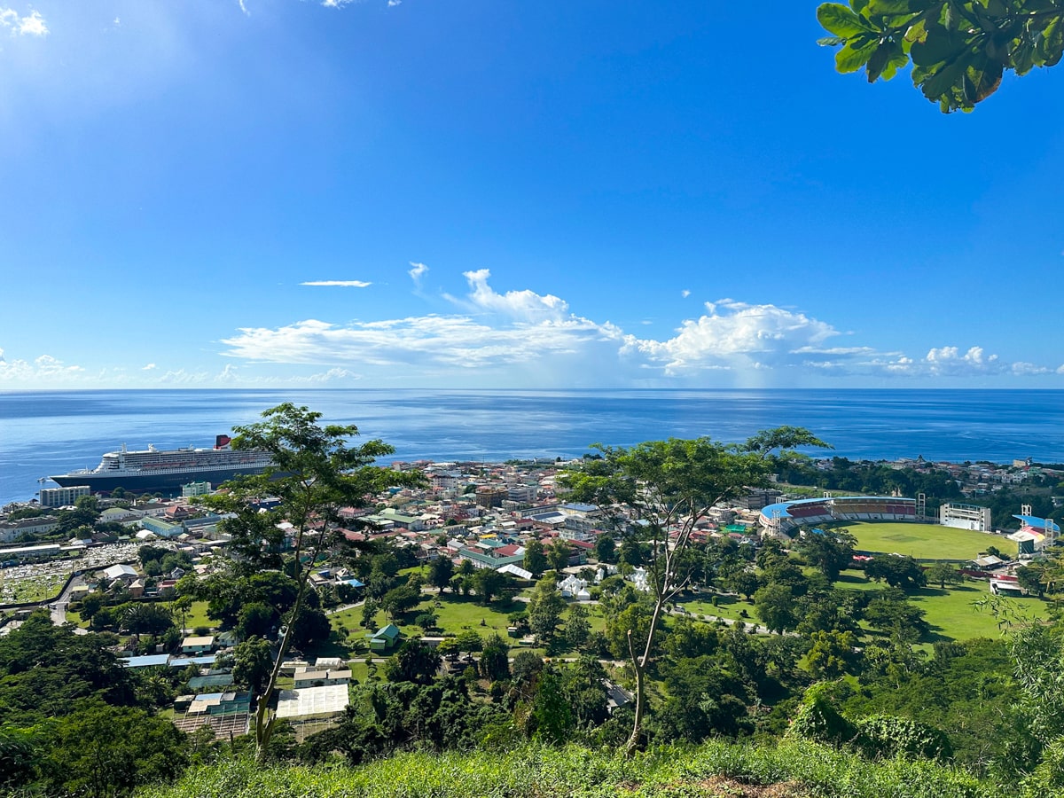 View of Roseau in Dominica with city below and cruise ship docked at the port