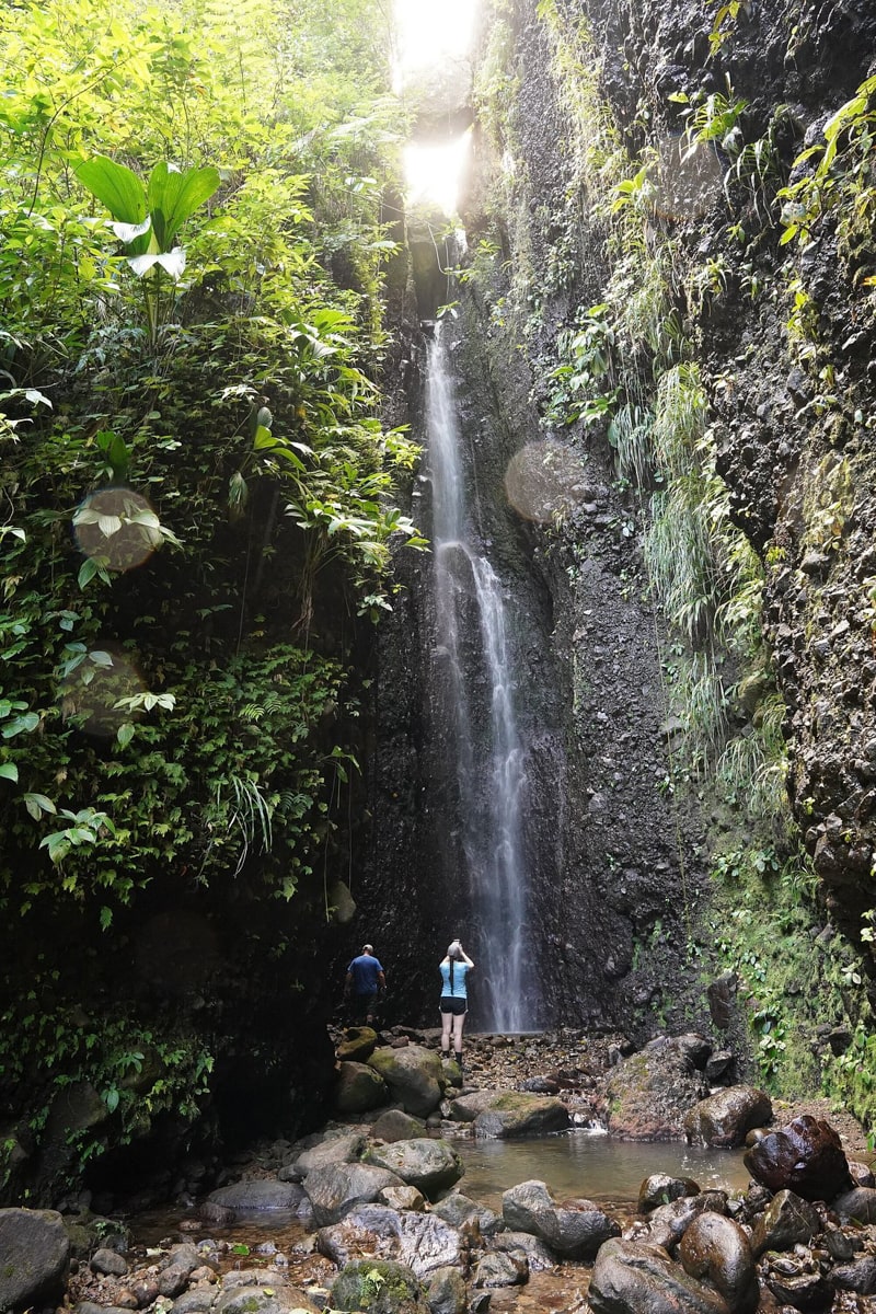 People standing and looking at Bwa Nef Falls 