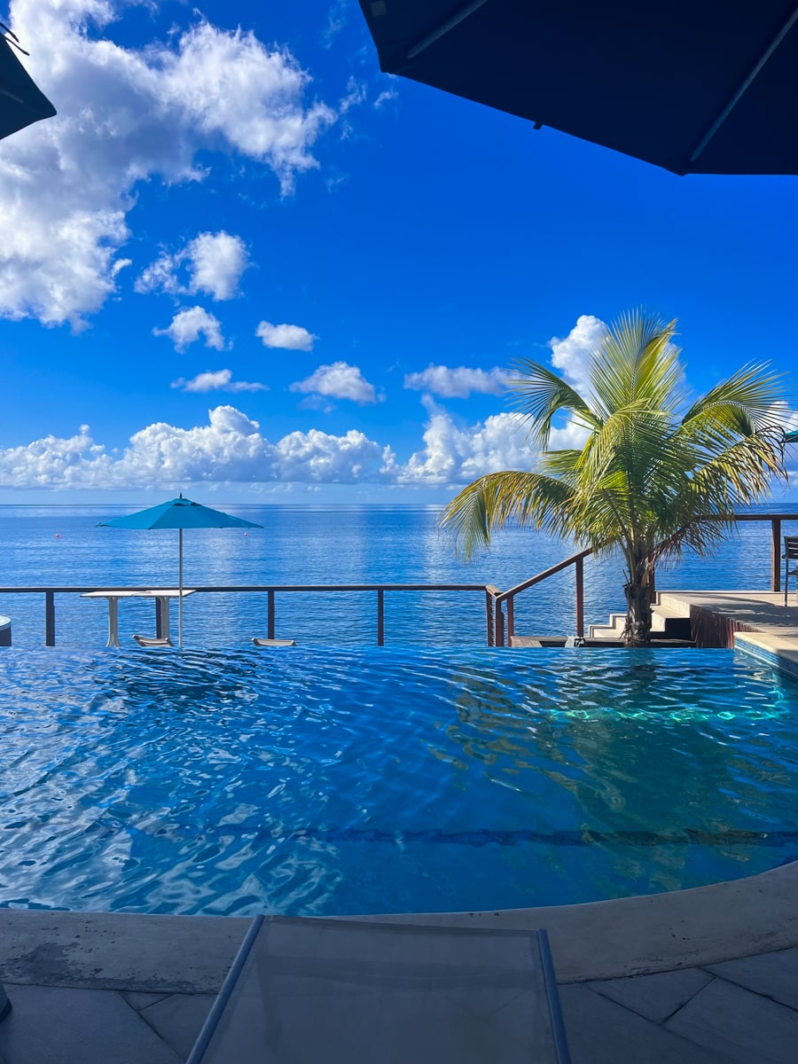 view from the pool overlooking the ocean  at Fort Young Hotel in Roseau 