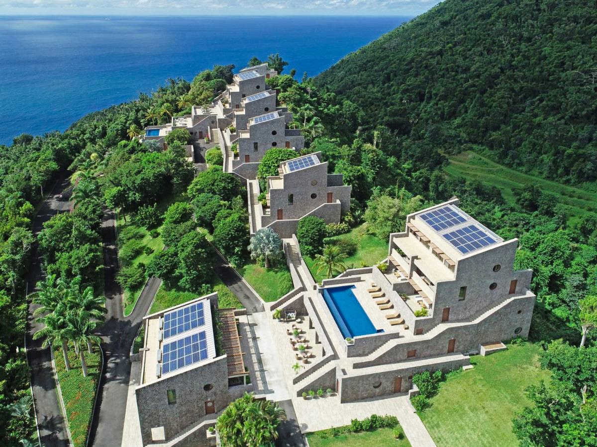 Coulibri Ridge resort aerial view of buildings with pools and solar panels