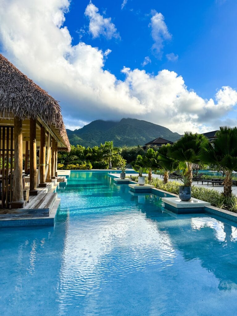 Pool view with mountain in background at Intercontinental Cabrits Resort in Portsmouth Dominica