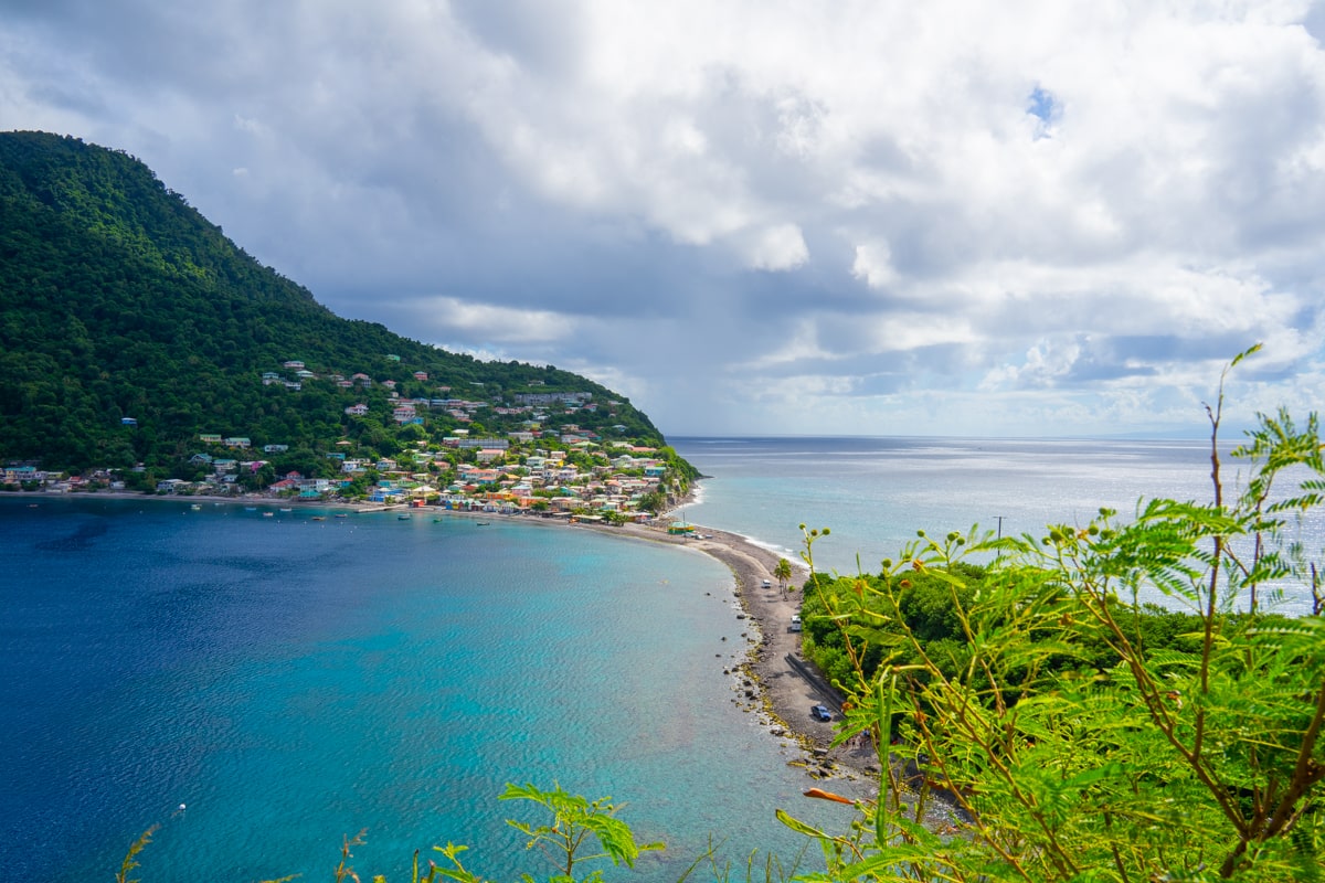popular scotts head picture of where the carribean sea meets the atlantic ocean divided by a small strip of land on Dominica