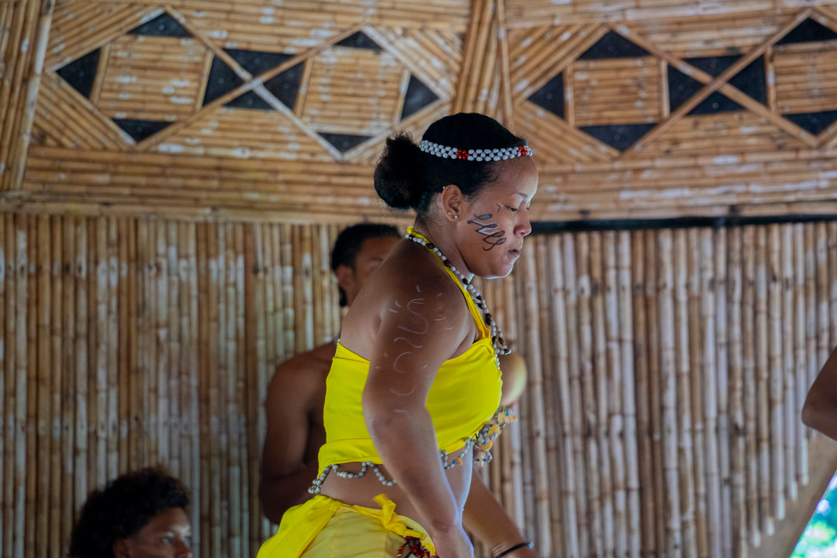 Woman dancing in the Kalinago Tribe with painted face 