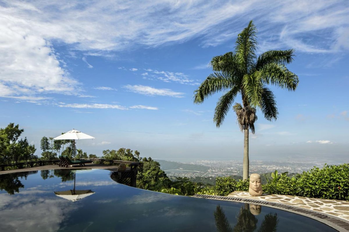 view of an infinity pool overlooking Kingston from Strawberry Hill in the Blue Mountains