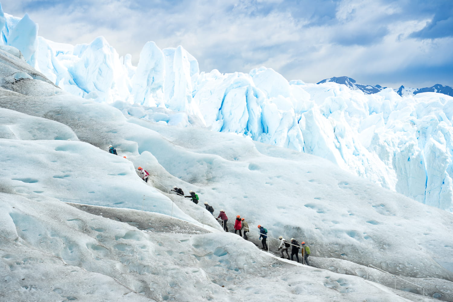 People trekking up ice steps on the Perito Moreno glacier in Argentina